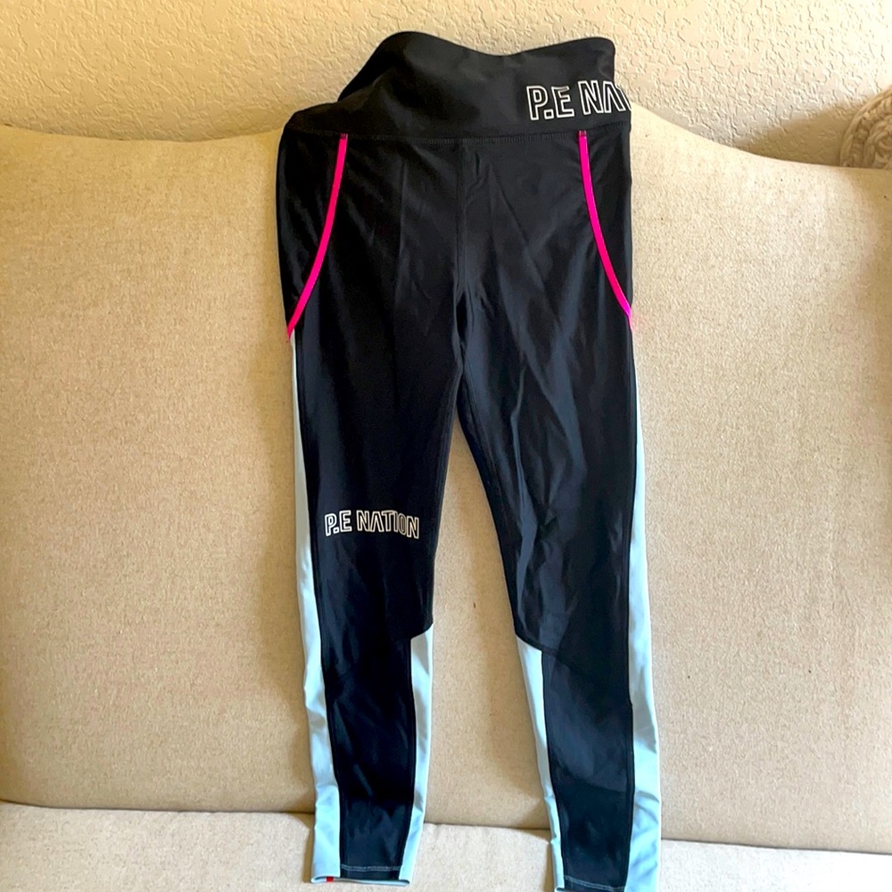 PE Nation NEVER worn.  Super cool!!! Runs small!